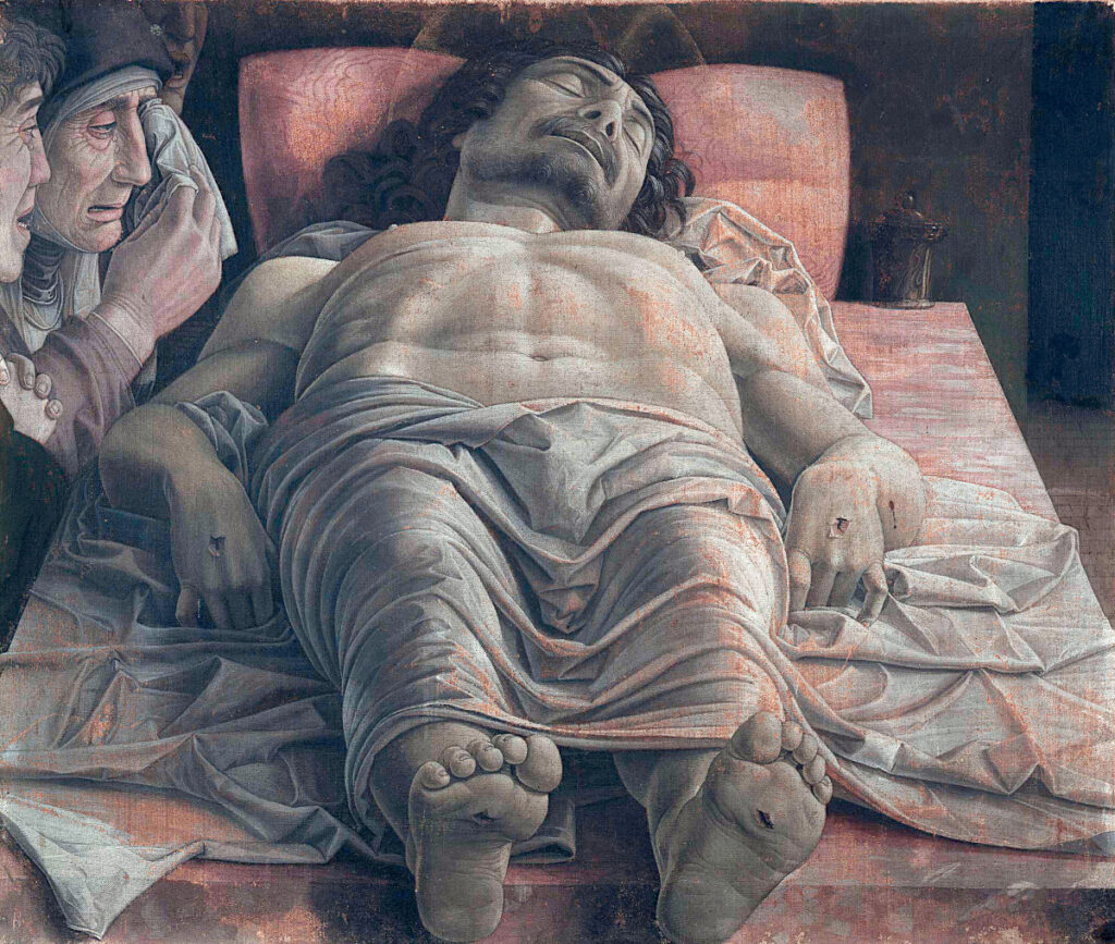 Il dipinto di oggi è: “Il Cristo morto (o Lamentazione siul Cristo morto)” uno dei più celebri dipinti di Andrea Mantegna, tempera su tela (68×81 cm), databile con incertezza tra il 1475-1478 circa e conservato nella Pinacoteca di Brera a Milano. L’opera è celeberrima per il vertiginoso scorcio prospettico della figura del Cristo disteso, che ha la particolarità di “seguire” lo spettatore che ne fissi i piedi scorrendo davanti al quadro stesso”